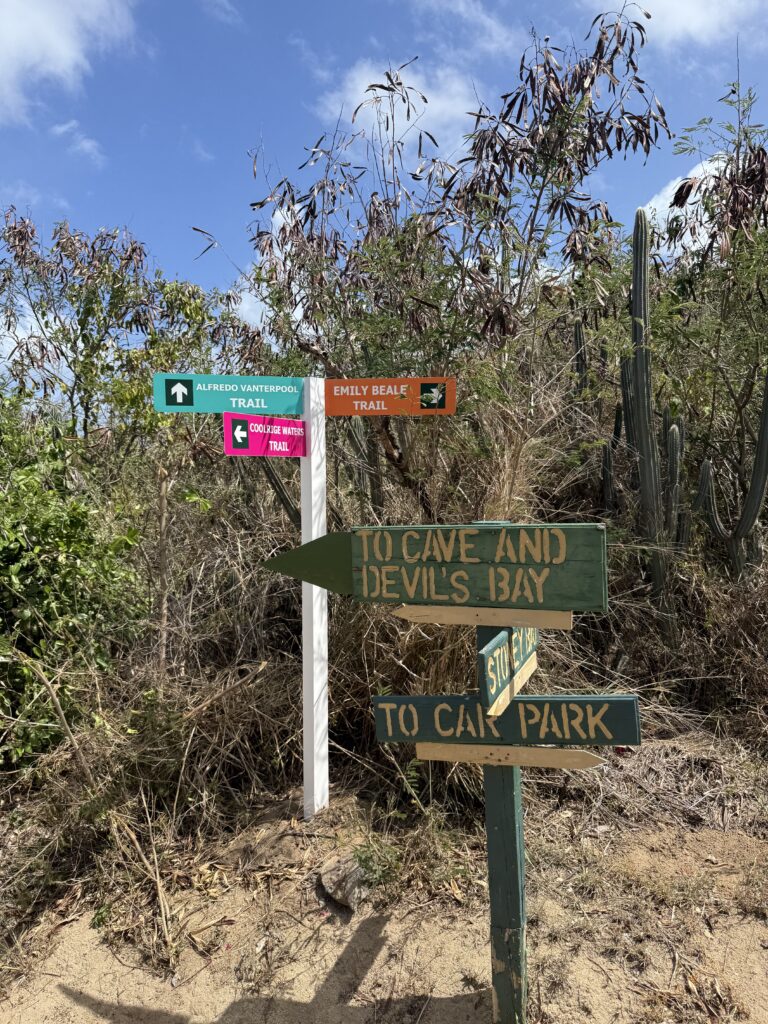 Trail sign pointing to Devil's Bay and the car park at the Baths, Virgin Gorda